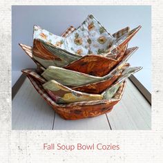 four bowls are stacked on top of each other with the words fall soup bowl cozies