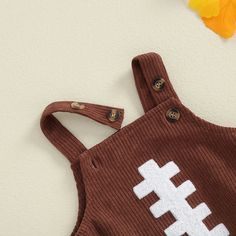 Includes: OnesieMaterial: PolyesterGender: Boys & GirlsPattern: FootballSleeve Length: SleevelessSummary: Baby Toddler Sleeveless Button Corduroy Football Onesie Cute Brown Tops For Playtime, Cute Brown Sleeveless Top, Football Onesie, Baby Toddler, Onesies, Football, Black, American Football