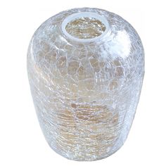 a clear glass vase sitting on top of a white table