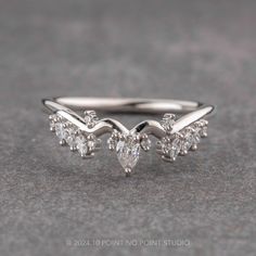 three pear shaped diamond engagement rings in white gold