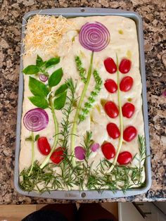 a tray filled with vegetables on top of a counter