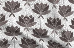 a white and brown flower pattern on fabric