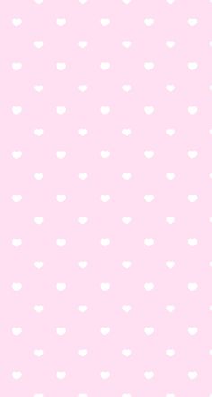 a pink background with white polka dots