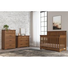 a baby crib and dresser in a room