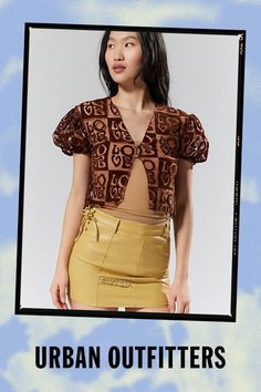 Gauzy top from House Of Suny. Designed with sheer panels throughout and cropped in a slim-fitting silhouette. Finished with puffy short sleeves and a split flyaway hem. Features House Of Sunny Casa Amor top Semi-sheer Cropped with a split-hem Button closure Content + Care 90% Nylon, 10% spandex Hand wash Imported Size + Fit Model in Chocolate is 5’9" and wearing size 4 Measurements taken from size 4 Chest: 34" Length: 17.5" | House Of Sunny Casa Amor Flyaway Top in Chocolate, Women's at Urban Outfitters Trendy Fitted Cropped Short Sleeve Top, Fitted Crop Top With Short Sleeves For Night Out, Fitted Short Sleeve Crop Top For Night Out, Fitted Brown Crop Top With Short Sleeves, Brown Fitted Short Sleeve Crop Top, Fitted Brown Short Sleeve Crop Top, Fitted Short Sleeve Top For Spring Night Out, Brown Short Sleeve Crop Top For Spring, Spring Brown Short Sleeve Crop Top