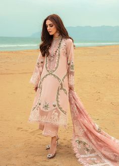 Brand: Saira ShakiraProduct Code: D-06B Winds of Eden - RoseCollection: Saira Shakira by Crimson Embroidered Luxury Lawn CollectionFabric: Lawn DESCRIPTION: In rose pink features a beautiful floral maze like composition. Painstakingly rendered in beautiful roses. Winds of Eden is reminiscent of a garden laden with roses. The neckline is a delicate hand embellished placket in Swarovski crystals and the tiniest of pearls. The sleeves have botanical motifs and a embroidery reminiscent to a beautiful garden at the hem. The dupatta is hand printed leaves with shades of ivory and jade, with botanical embroidery on the corners. DESIGN DETAILS: Embroidered front Embroidered organza border for front and back daman Embroidered organza border for sleeves 0.6m embroidered sleeves 0.66m embroidered bac Crimson Lawn, Embroidery Shirts, Saira Shakira, Lace Dress Design, Model Outfit, Embroidered Pants, Luxury Wear, Shirt Embroidery, Fabric Stores Online