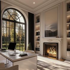 an office with a fireplace and large windows