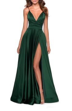 Free shipping and returns on La Femme Strappy Back Satin Ballgown at Nordstrom.com. Liquid shimmer pours down this satin ballgown cut with no small measure of daring via a plunging neckline, an open back and an unexpected front slit. Vestidos Color Verde Esmeralda, Flowy Prom Dresses, Gown Couture, Gown For Prom, Dress Couture, Spaghetti Strap Prom Dress, Prom Dress Styles, Prom Style, Couture Candy