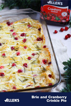 a casserole dish with cranberries and herbs on it