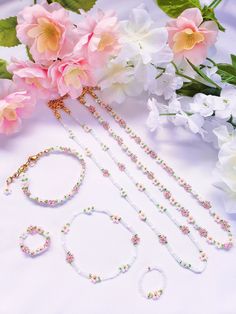 🌷 Spring Collection: Sakura 🌷 Collection features 8 color options! Includes two necklaces + two bracelets + two rings (6 pieces total) Pieces are also available for purchase separately & as sets! **Adjustable length** Bracelets are 5.75 inch + 1.5 inch gold extender Necklaces are 14.2 inch + 2.5 inch gold extender ☁️ Custom sizing is available in the personalization box! ☁️ Made with 2mm glass seed beads Gold material: stainless steel (durable & tarnish-resistant) *All rings are waterproof & c Flower Bead Jewelry, 2mm Bead Bracelet, Flower Bead Ring, Beaded Bracelet Flower, Beaded Necklace Flower, Cute Beaded Bracelet, Diy Earrings Dangle, Rings Beaded, Beaded Flower Necklace