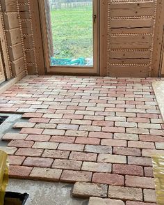 a brick patio being installed in front of a door