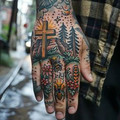 a person with a cross on their hand