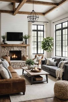 a living room filled with furniture and a fire place in the middle of the room