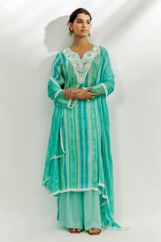 Cyan blue kurta featuring stripe print with sequin embroidered neckline. Paired with solid palazzo and a lace hem dupatta. - Aza Fashions Bollywood Style Embroidered Turquoise Sets, Turquoise Embroidered Anarkali Set, Turquoise Chanderi Sets, Festive Turquoise Embroidered Sets, Blue Embroidered Bohemian Palazzo Set, Turquoise Sets With Resham Embroidery In Traditional Drape, Blue Bohemian Embroidered Sharara, Turquoise Cutdana Sets, Festive Embroidered Turquoise Sets