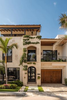 a large house with lots of plants on the front