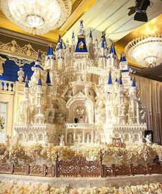 an elaborately decorated castle with chandeliers and lights