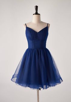 This navy blue dream is crafted in pleated tulle material, boasting a fitted bodice with spaghetti straps, an empire waistline and built-in-bra. Ready to dance the night away, this mini dress features a zip-up back and a length abover the knee! Blue Tulle Dress With Spaghetti Straps, Tulle Dress With Adjustable Spaghetti Straps, Blue Grad Dresses, Blue Hoco Dress, Short Princess Dress, Spring Dance, Grad Dresses Short, Teal Cocktail Dress, Fancy Short Dresses