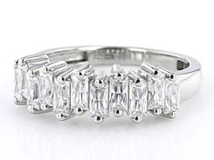 Moissanite Fire® .99ctw diamond equivalent weight baguette Platineve(® band ring. Measures approximately 1/4" L x 1/16" W and is not sizeable. Actual moissanite weight is .99ctw. Dazzling White Topaz Baguette Cut Diamond Ring, Baguette Cut White Topaz Diamond Ring, Moissanite Diamond Ring With Channel Set Baguette Cut, Channel Set Moissanite Diamond Ring With Baguette Cut, Modern Baguette Cut Diamond Ring With Prong Setting, Channel Set Diamond Ring With Baguette Cut Cubic Zirconia, Baguette Cut Diamond Ring With Channel Set Cubic Zirconia, Baguette Cut Cubic Zirconia Diamond Ring With Channel Set, Modern Cubic Zirconia Diamond Ring With Baguette Cut