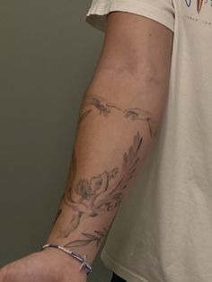 a man with a tattoo on his arm