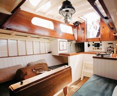 the interior of a boat with wood paneling