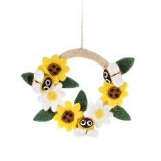 two sunflowers are hanging from a wreath