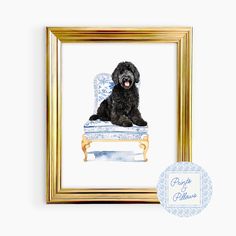 a black dog sitting on top of a blue and white chair in a gold frame