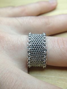 I tried a few things and came up with this trim to solve the floppy edges problem. The trim is simply a row with the rings on top instead of below. This make... Chainmaille Ring, Chainmail Ring, Chainmaille Jewelry, Chainmail Jewelry, Chain Maille Jewelry, Chain Maille, Handmade Jewelry Designs, Chain Mail