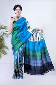 This borderless soft silk saree has a majestic combination of mughalkari buta print along with a geometric zig-zag print. Our artisans have done a great job with this saree. This is the first time when they combined a mugahlkari buta with a multicolor print. And the result is iconic. Like any of our sarees, this saree is also silk mark certified. It means you don't have to worry about the quality of the saree. And when you shop with us, you always get the best quality and authentic products. If you're a saree lover, this should be in your collection. A saree for everyone This is the best borderless soft silk saree to show your personality on any occasion. Ideal party wear, women from all across the world have shown their interest in this saree. This saree looks awesome for women of all age Silk Saree With Block Print In Blue, Blue Silk Saree With Block Print, Blue Block Print Tussar Silk Saree, Blue Art Silk Saree With Block Print, Green Block Print Art Silk Saree, Multicolor Tussar Silk Saree With Border, Multicolor Silk Saree With Border, Unstitched Blue Saree With Border, Multicolor Pre-draped Saree With Printed Border In Tussar Silk