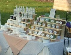 a table with many bottles and containers on it