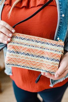 Your favorite clutch is in a whole new pattern and material for summer! So many pockets and room to hold all of your essentials! It has a zip closure, detachable wrist or shoulder strap that can be worn on the shoulder or crossbody, and supple faux leather. The gorgeous strawberry, mint, navy, andnatural colors are amazingly woven together in a fun pattern. Measurements Measurements: 9" long x 5” tall x 1.5” deep Shipping Free standard shipping on all orders of $150 or more! Free In-store Pick-u Casual Travel Pouch For Spring, Casual Clutch With Adjustable Strap For Travel, Casual Travel Clutch With Adjustable Strap, Casual Summer Clutch With Removable Pouch, Summer Travel Pouch With Removable Pouch, Summer Travel Pouch With Removable Section, Summer Everyday Crossbody Clutch, Summer Crossbody Clutch For Everyday Use, On-the-go Clutch With Zipper Closure