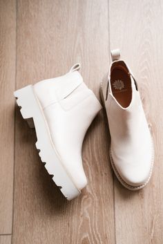 The Zari Boot is a sleek, minimalist ankle boot designed with modern functionality and effortless style in mind. Featuring a smooth, off-white faux leather finish and a chunky lug sole for added traction and comfort, these boots are perfect for everyday wear. Slip-on design with elastic side panels ensures easy on-and-off convenience, making them ideal for the woman on the go.

Closure: slip-on
Toe Shape: almond
Heel Height: 2 inches
Platform Height: 1.5 inches
Boot Shaft: 4 inches
Materials: faux leather
Insole: Yellow Box custom contoured insole
Outsole: EVA Yellow Box Shoes, Leather Finish, Designer Boots, Lug Sole