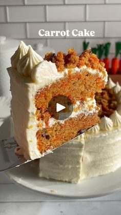 a carrot cake on a plate with a knife