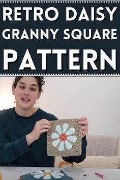 a woman holding up a crocheted square with flowers on it and the words retro daisy granny square pattern