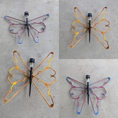 four different colored butterfly shaped hair clips on concrete surface with black pins in the middle