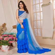 Blue colored saree is made from georgette fabric which is highlighted with beautiful printed with embroidered belt as shown. comes along unstitched embroidered georgette blouse piece which you can customise as per your design/style. Occasion - You can wear this saree for party, functions and ideal for any fashionista. Note:- The actual product may differ slightly in color and design from the one illustrated in the images when compared with computer or mobile screen. Measurements: Saree : Georget Saree For Party, Ruffle Saree, Embroidered Belt, Georgette Blouse, Cyan Blue, Mobile Screen, Georgette Fabric, Blue Ombre, Blouse Piece