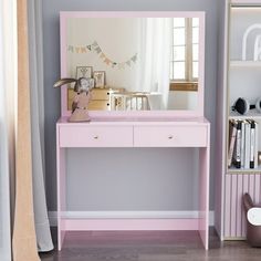 a pink desk with a mirror on it in front of a bookcase and bookshelf