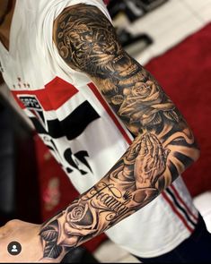 a man with a tattoo on his arm