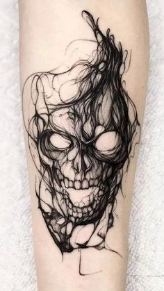 a black and white skull tattoo on the leg