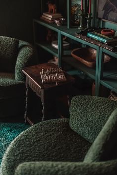 a living room with two chairs and a table