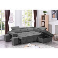 a grey sectional sofa with storage underneath it