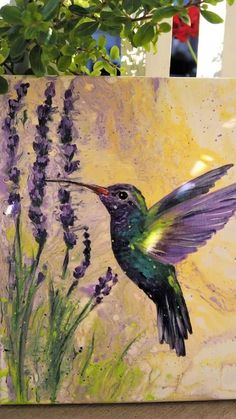 a painting of a hummingbird with purple flowers in the foreground and a yellow background