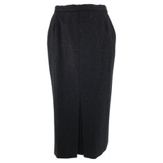 Chanel charcoal wool kick pleat front, curved hip front pocket, pencil skirt. 1990s dark charcoal wool skirt has a narrow band waist, the skirt closes at the side with a bar hook at the waist and a gold Chanel button & button hole, side zipper closure. The closure is part of the hip side pocket. Pencil straight skirt has an inverted pleat at the hem front. Fully lined in black rayon. Fits a size small. In excellent wearable condition. All our clothing is dry cleaned and inspected for condition a Pleated Pencil Skirt, Chanel Skirt, Evening Skirts, Gold Chanel, Kick Pleat, Skirt Vintage, Wool Skirt, Gathered Skirt, Straight Skirt