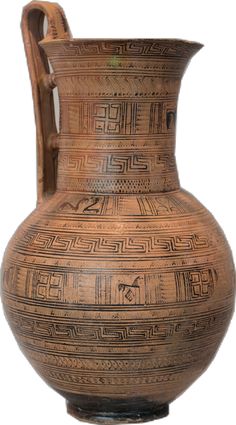 an old brown vase with designs on it