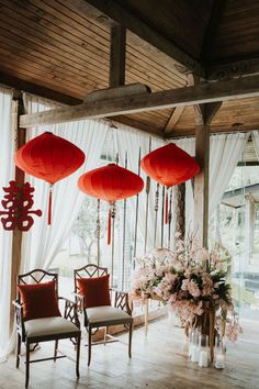 the room is decorated with red lanterns and flowers