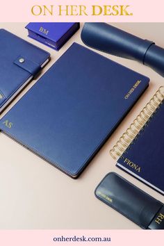 there is a notebook, pen and other items on the table