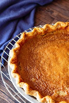 a pie sitting on top of a metal rack