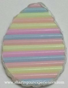 an egg shaped candy bar with multicolored stripes