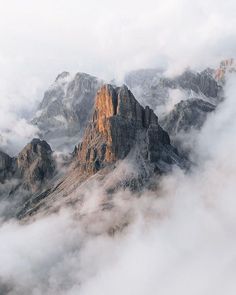 some very pretty mountains in the clouds with no one on it's top or bottom