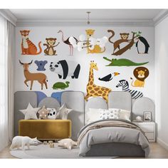 a child's bedroom decorated with animal wall decals