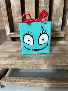 a blue box with eyes painted on it